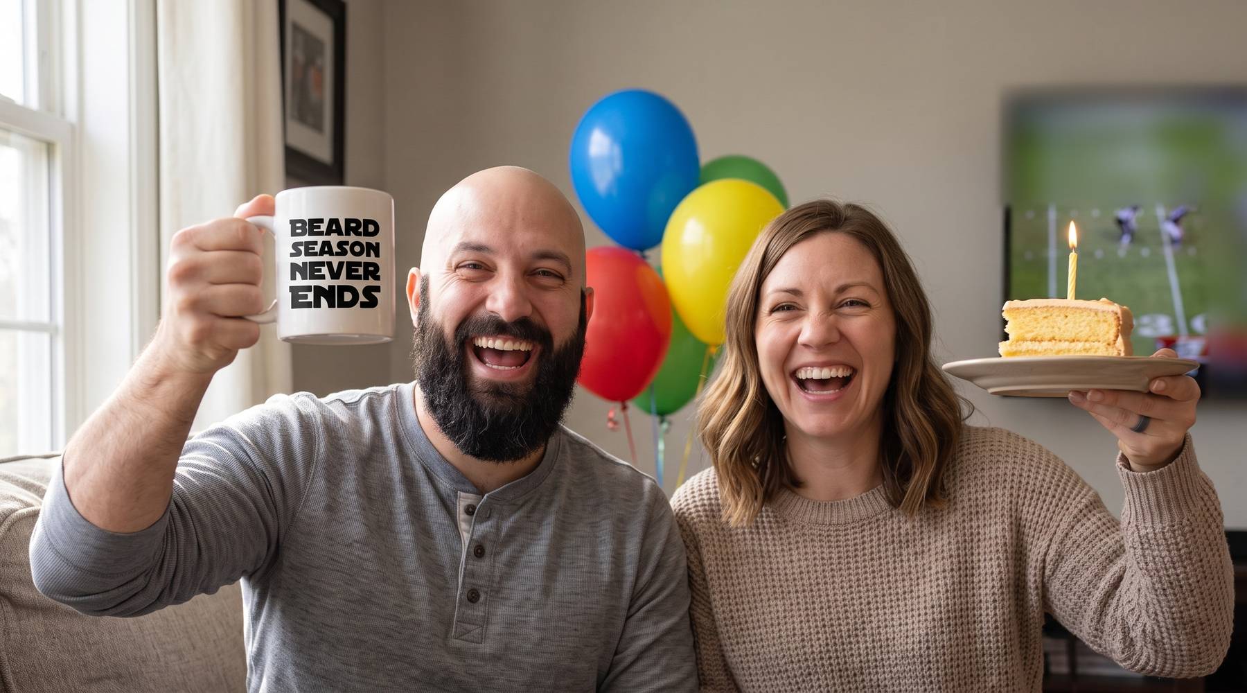 A bearded husband laughing as he raises his Beard season never ends mug while his wife holds up a slice of birthday cake with a candle