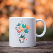 Astronaut Holding Planet Balloons Ceramic Mug 11 oz White - Panvola