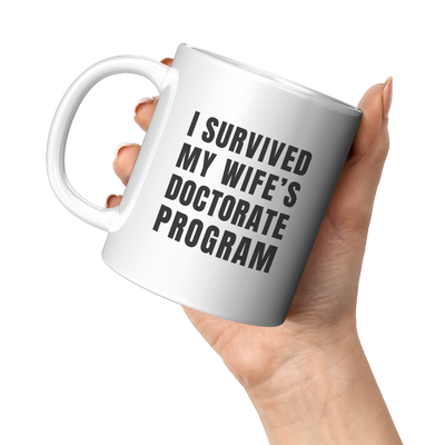 I_Survived_My_Wifes_Doctorate_Program_11oz_White_LH_Model_Mockup.png
