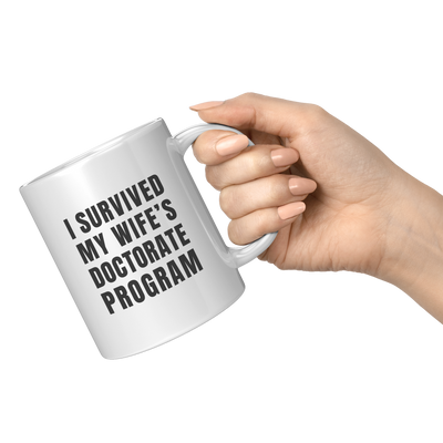I_Survived_My_Wifes_Doctorate_Program_11oz_White_RH_Model_Mockup.png